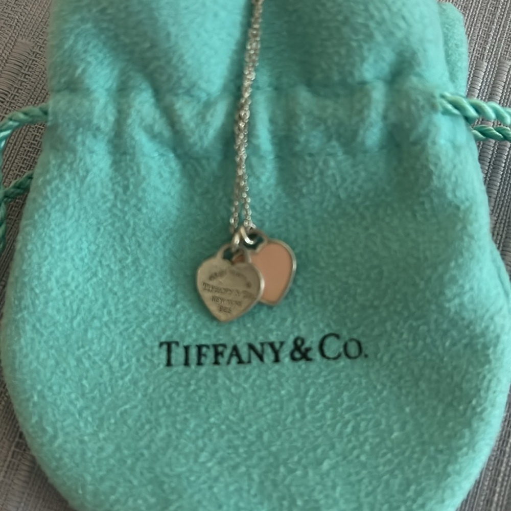 Tiffany & Co. Double mini pink heart tag pendant and necklace.